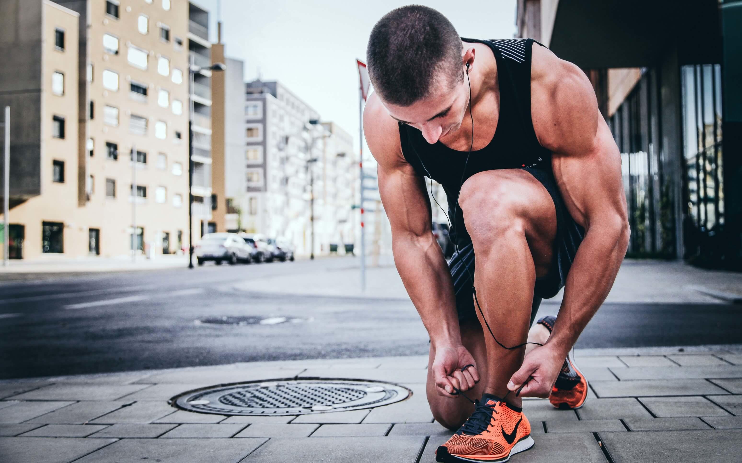 athlete tying shoelace