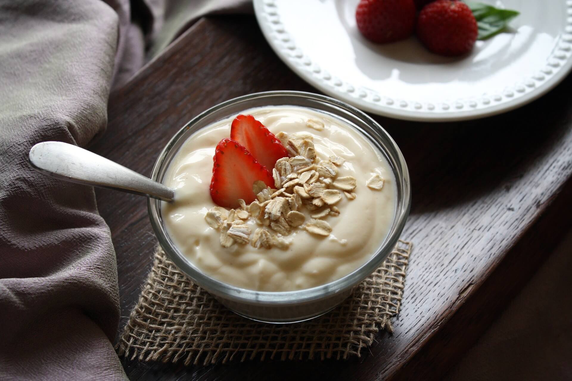 a bowl of yogurt and strawberries